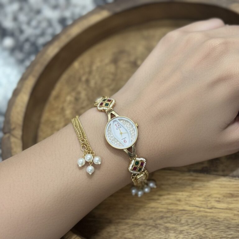 Gold kundan style watch bracelet with pearl tassels and chain detailing