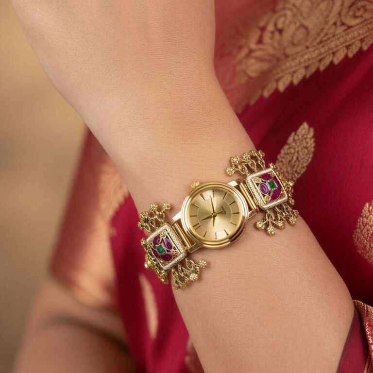 Gold heritage watch bracelet with kundan detailing and floral motifs in traditional design.